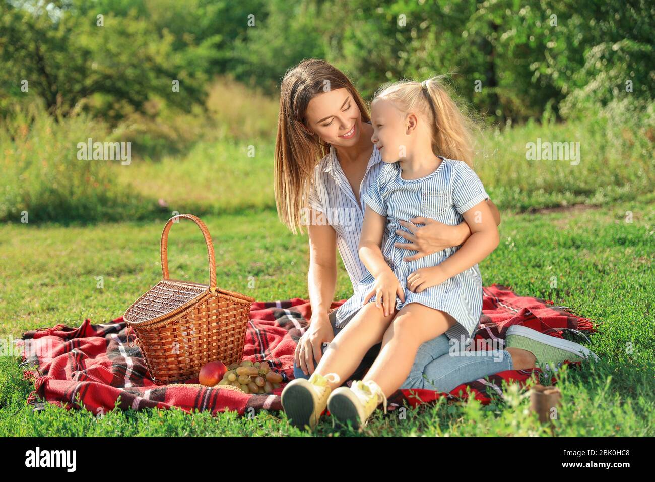 Happy mother and daughter at picnic outdoors Stock Photo - Alamy