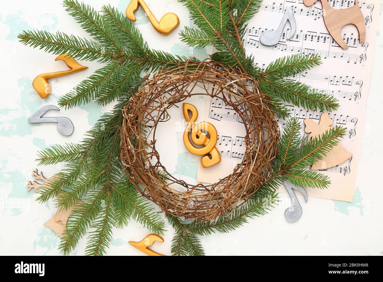 Composition with note sheets and Christmas decor on light background Stock Photo