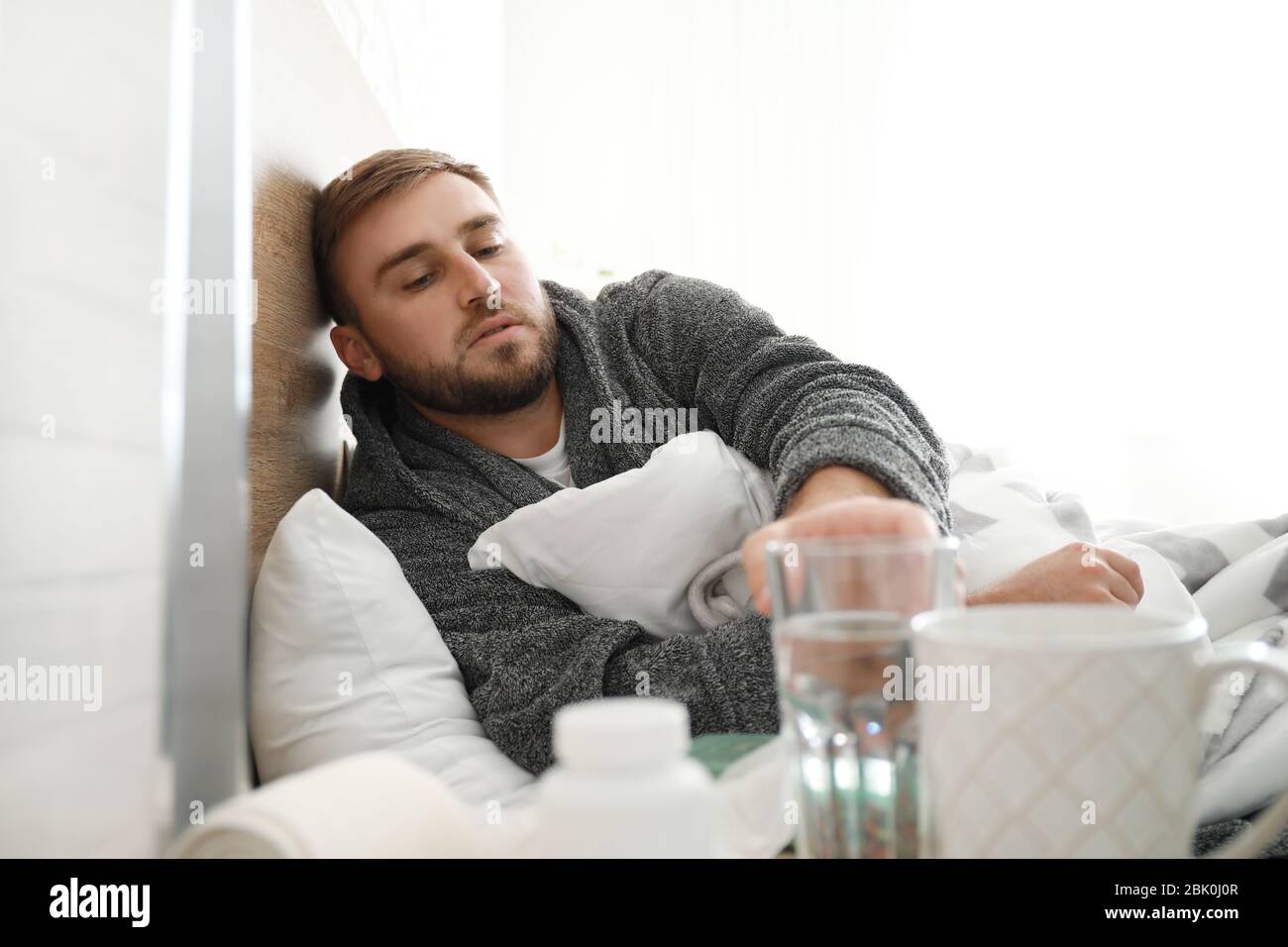 Man lying ill in bed hi-res stock photography and images - Alamy