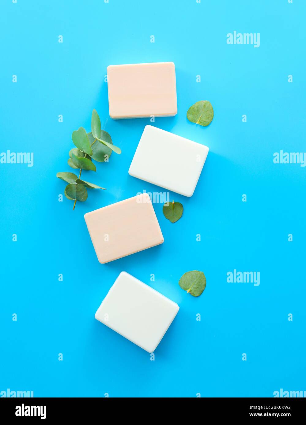 Soap bars with eucalyptus on color background Stock Photo - Alamy