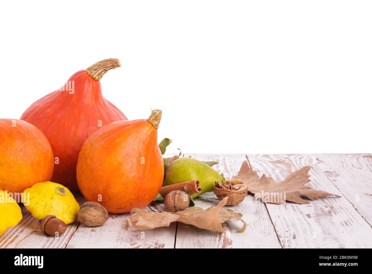 Autumn composition with fresh pumpkins and squashes on wooden table ...