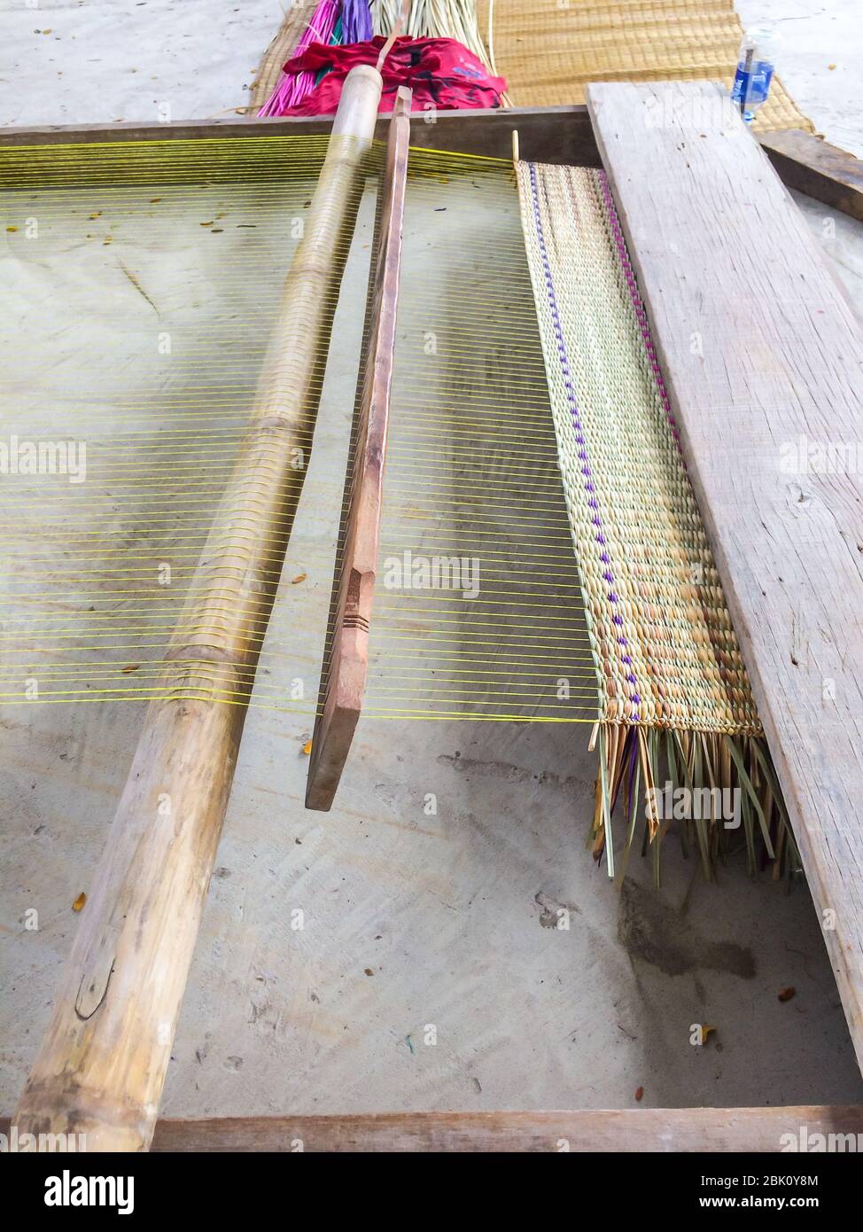 The right equipment for woven mats traditional made of solid wood are product handmade in countryside of Thailand. Stock Photo