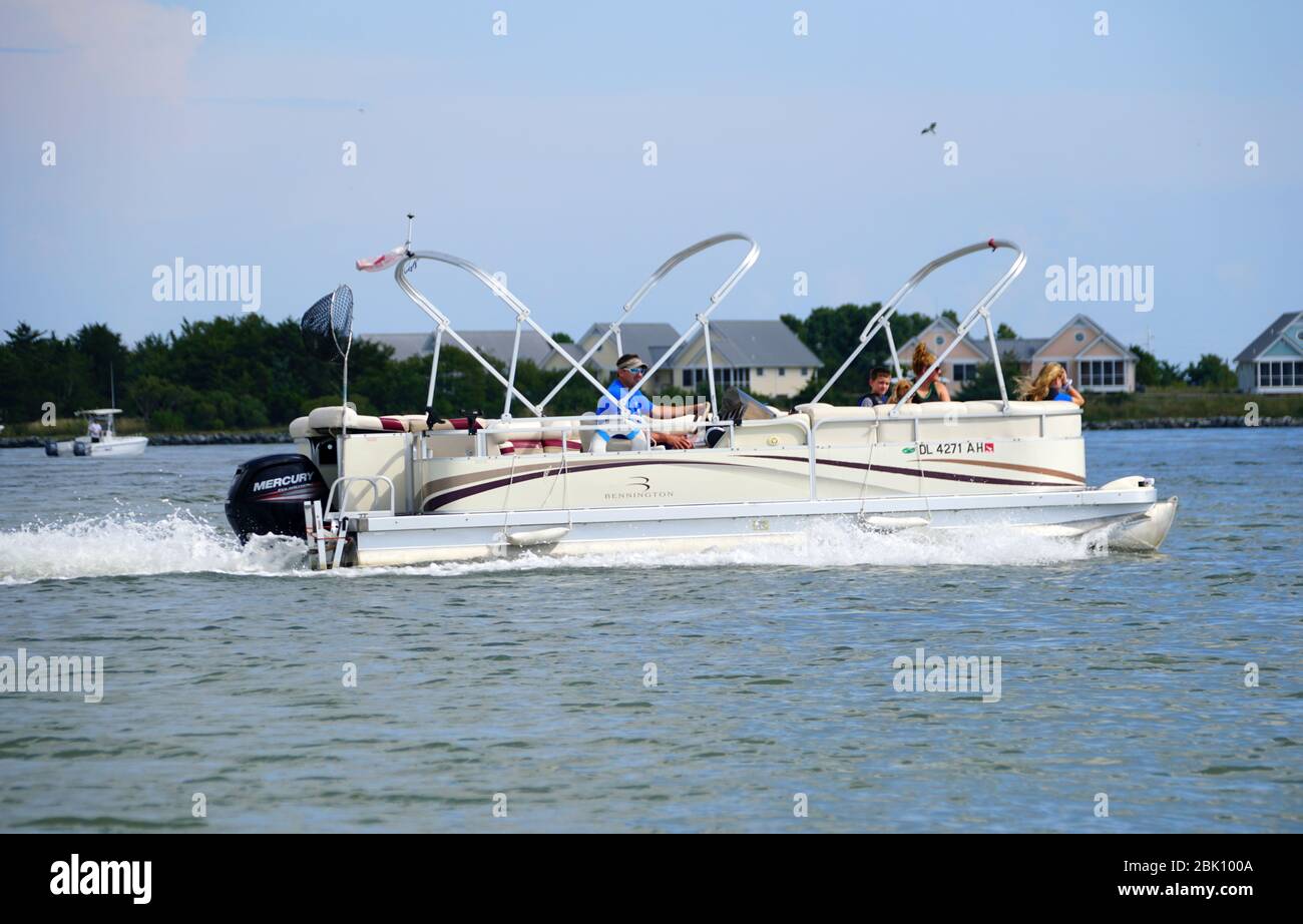 Bethany Beach, Delaware, U.S.A - September 2, 2019 - A pontoon boat on the Indian River Inlet during summer Stock Photo