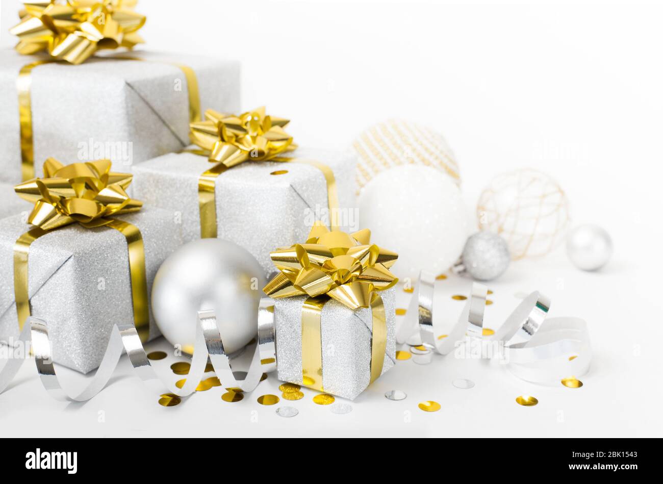 Christmas banner. Xmas silver gifts box with gold bows, white