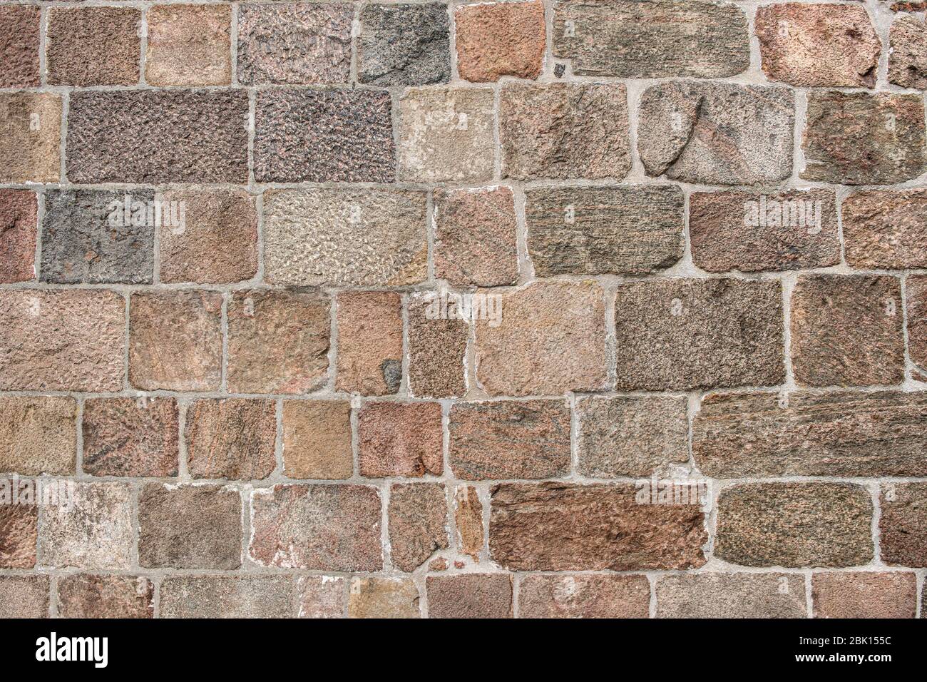 Wall of grouted stone blocks of different sizes, background, Germany Stock Photo