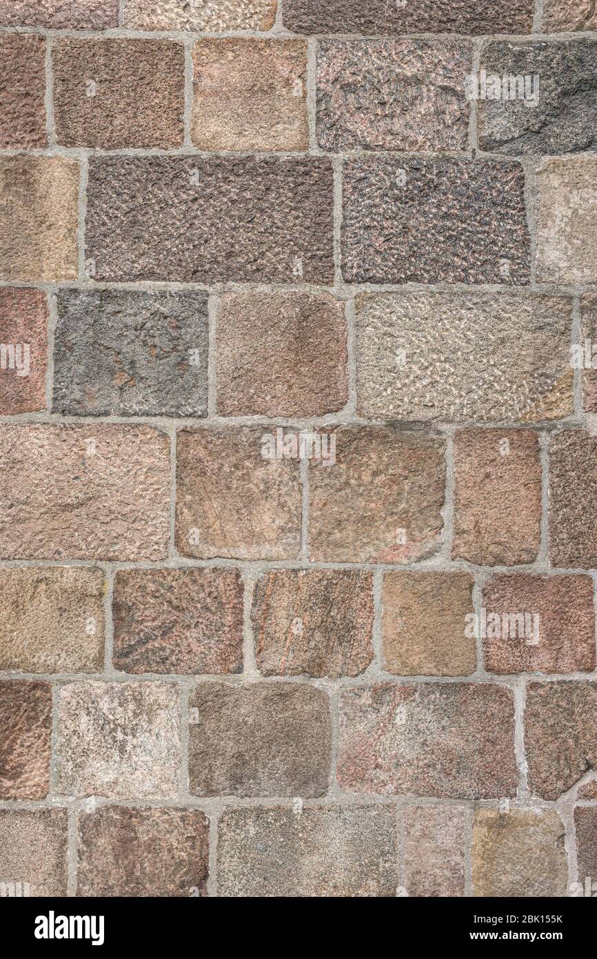 Wall of grouted stone blocks of different sizes, background, Germany Stock Photo