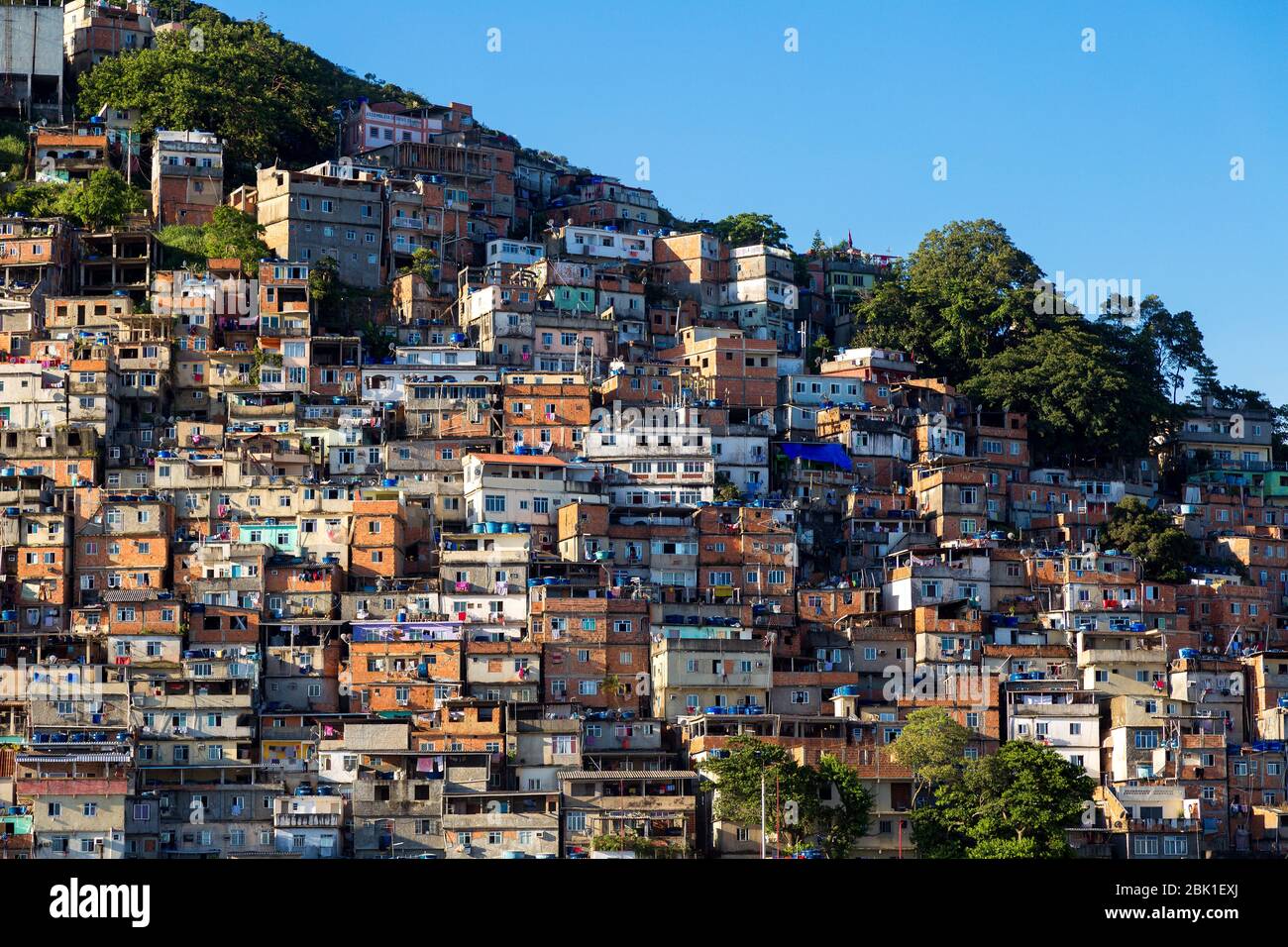 Favela of Rio de Janeiro, Brazil. Colorful houses in a hill. Zona Sul of Rio. Poor neighborhoods of the city. Stock Photo