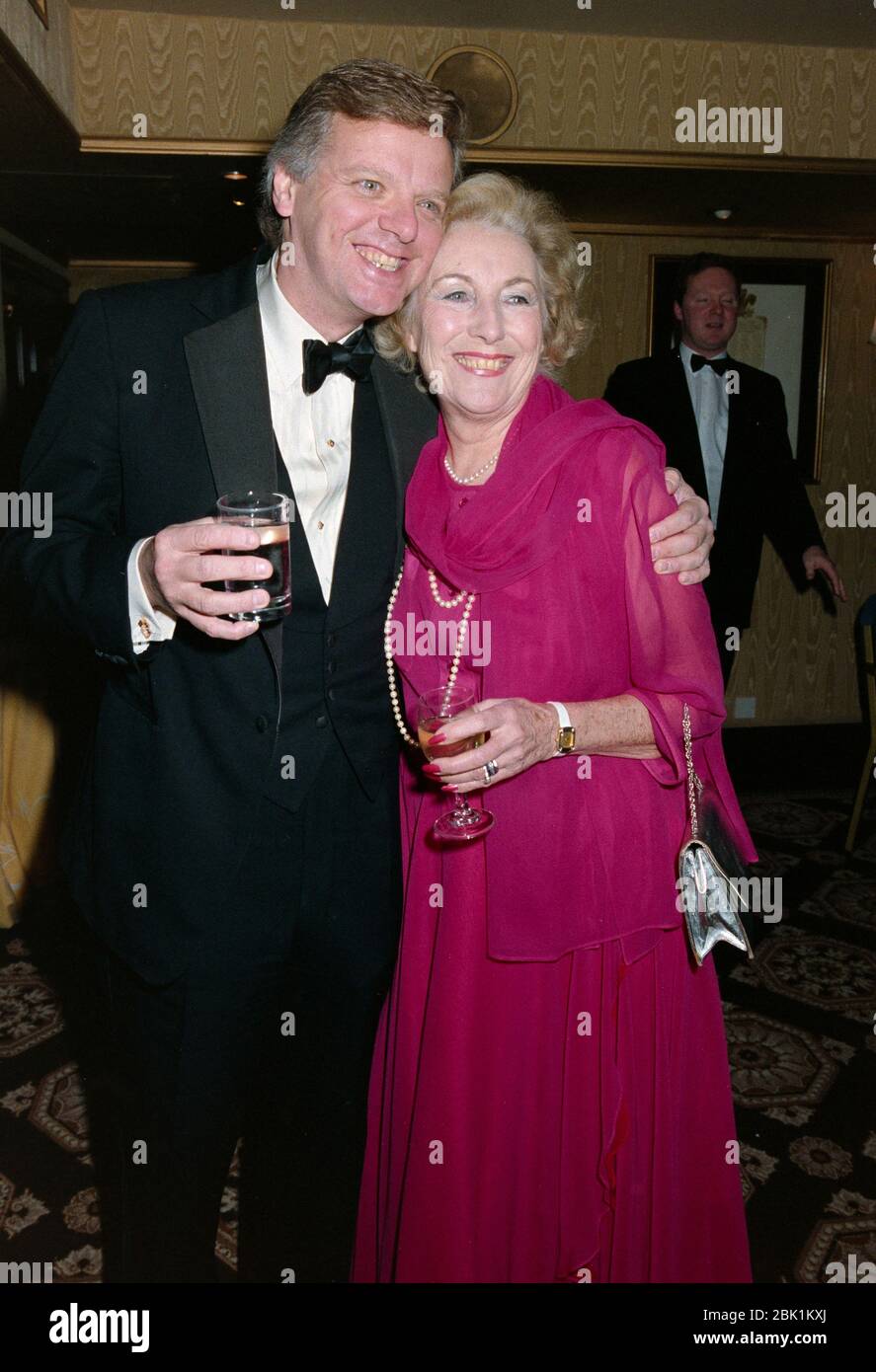 LONDON, UK. December 4, 1990: Singer Vera Lynn & producer Michael Grade at the Diamond Ball at the Royal Lancaster Hotel, London. File photo © Paul Smith/Featureflash Stock Photo