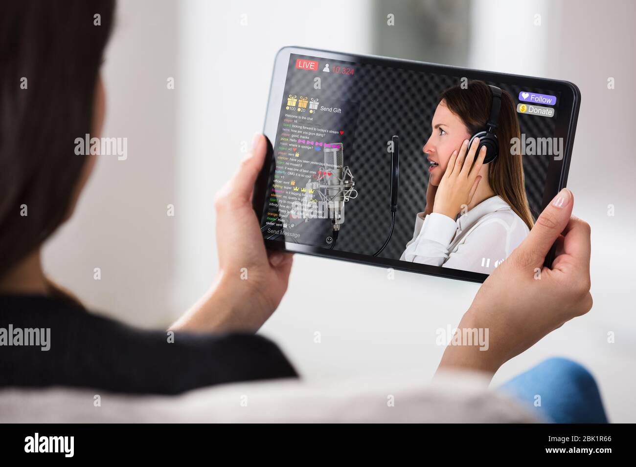 Streaming Live Music Video With Singer On Tablet Computer Stock Photo