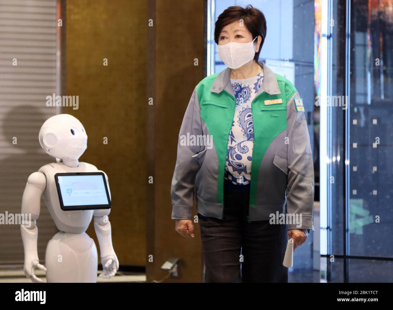Tokyo, Japan. 1st May, 2020. Tokyo Governor Yuriko Koike is greeted by a humanoid robot Pepper as she inspects the new accomodations for the patients of the new coronavirus with mild symptons as Tokyo Metropolitan Government hired a hotel in Tokyo on Friday, May 1, 2020. Tokyo Metropolitan Government opens an additional medical lodging facilities for the new coronavirus patients while Softbank's humanoid robot Pepper and cleaning robot Whiz will work to help caretakers at the facilities. Credit: Yoshio Tsunoda/AFLO/Alamy Live News Stock Photo