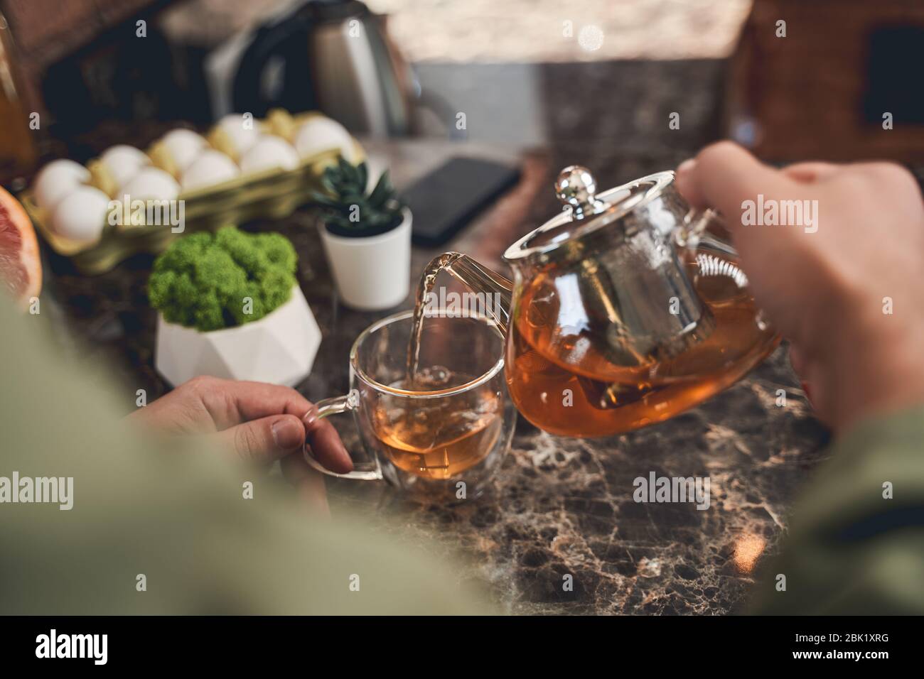 Brewing tea in glass teapot hi-res stock photography and images - Alamy