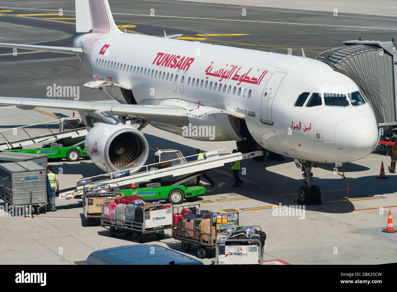 Istanbul / Turkey - September 14, 2019: Airport workers loading the luggage bags into a Tunisair Airbus A320 at the new Istanbul Airport, Istanbul Hav Stock Photo