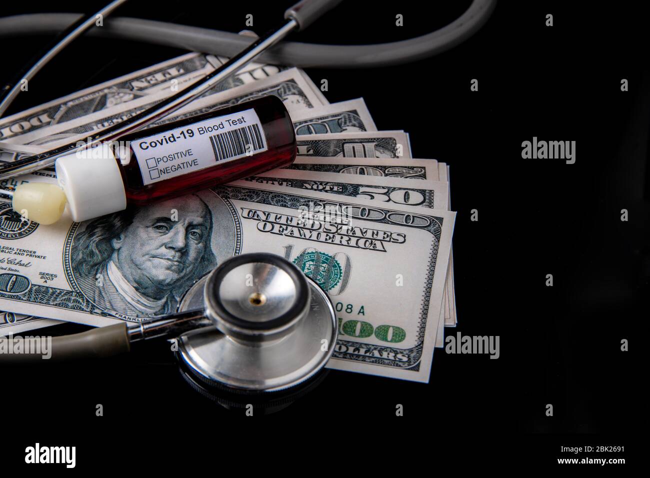 Concept of economy crisis and recession in USA during coronavirus or covid-19 pandemic with US dollars stethoscope and black background Stock Photo