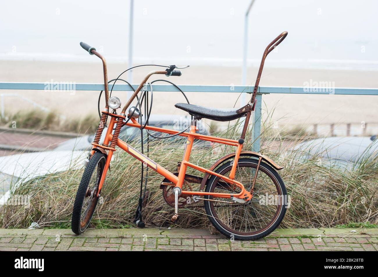 Old holland classic banana seat bicycle vintage bicycle in public.  Cityscape view. Dutch lifestyle Stock Photo - Alamy