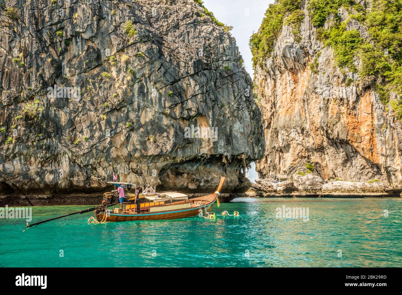 Thai long tail boats with tourists at Koh Chuek near Koh Lanta, Krabi, Thailand Stock Photo