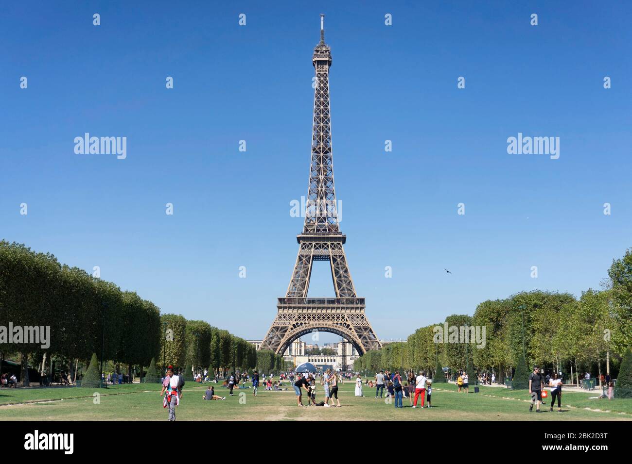 PARIS, FRANCE - SEPTEMBER 15, 2019: View at the Eiffel Tower from the Champ de Mars (Field of Mars). Stock Photo