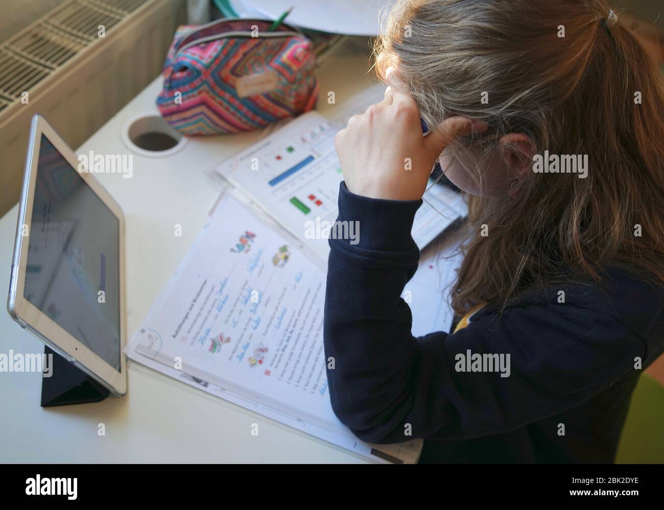 Real 10 year old girl is doing homeschooling, learning at home, doing ...