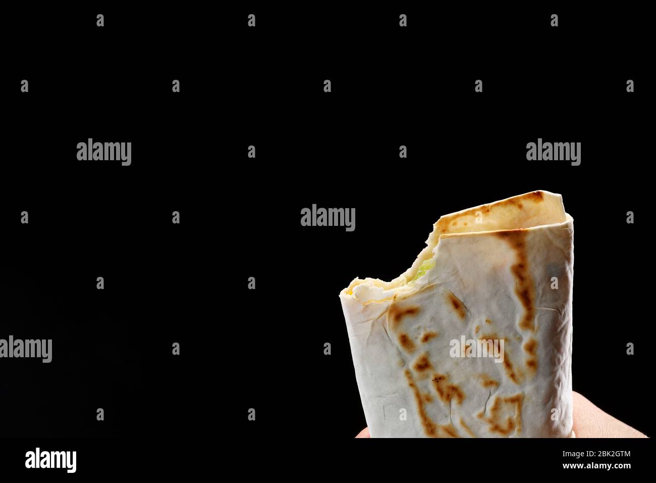 bit off a pita bread, fajitas, burrito, shawarma on a white background