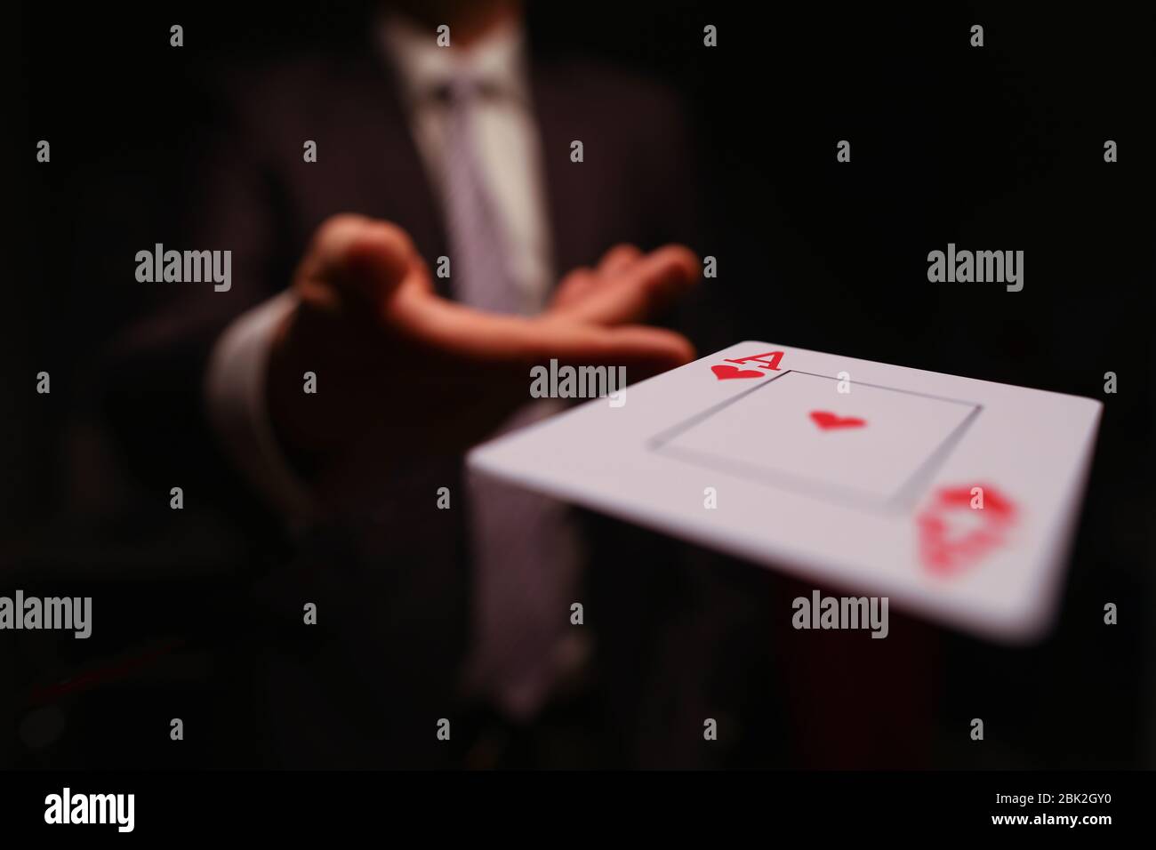 Player throwing playing card Stock Photo Alamy
