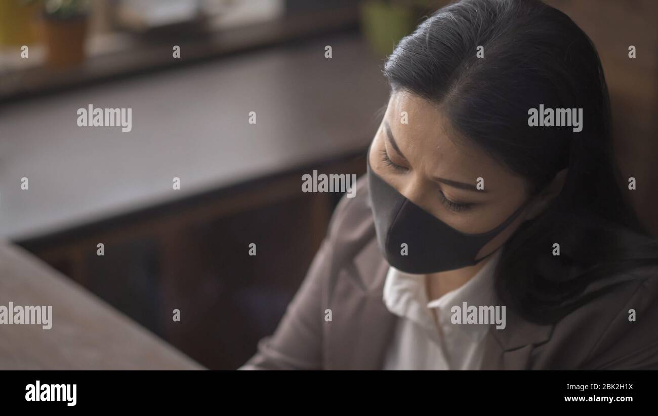 Asian woman in protective hi-res stock photography and images - Alamy