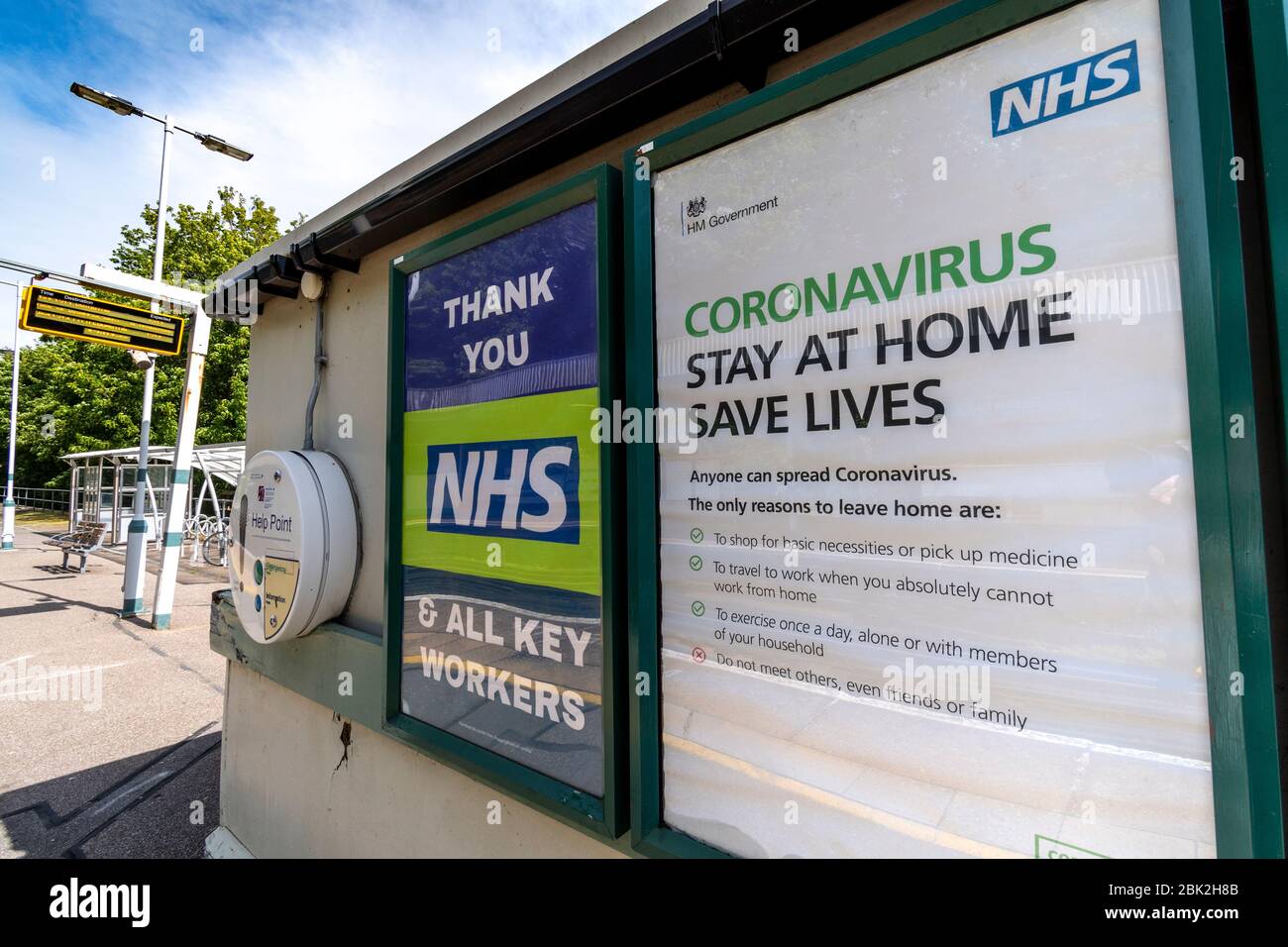 Covid-19 public health poster at railway station Stock Photo