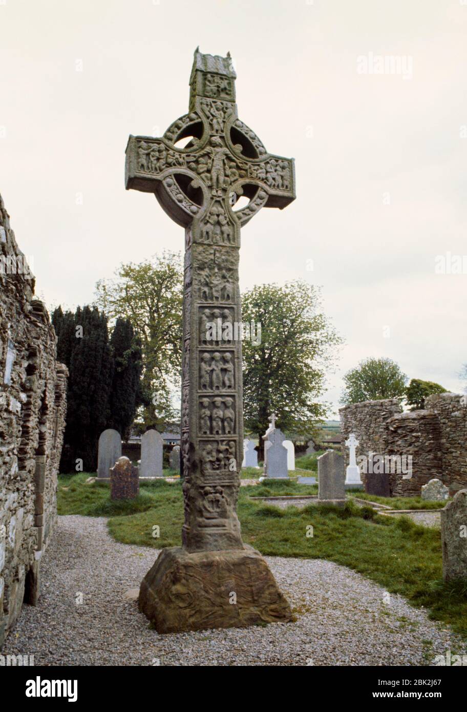 W face of Tall Cross (West Cross) beside North Church, Monasterboice, Co Louth, Republic of Ireland: a C10th High Cross showing the Life of Christ. Stock Photo