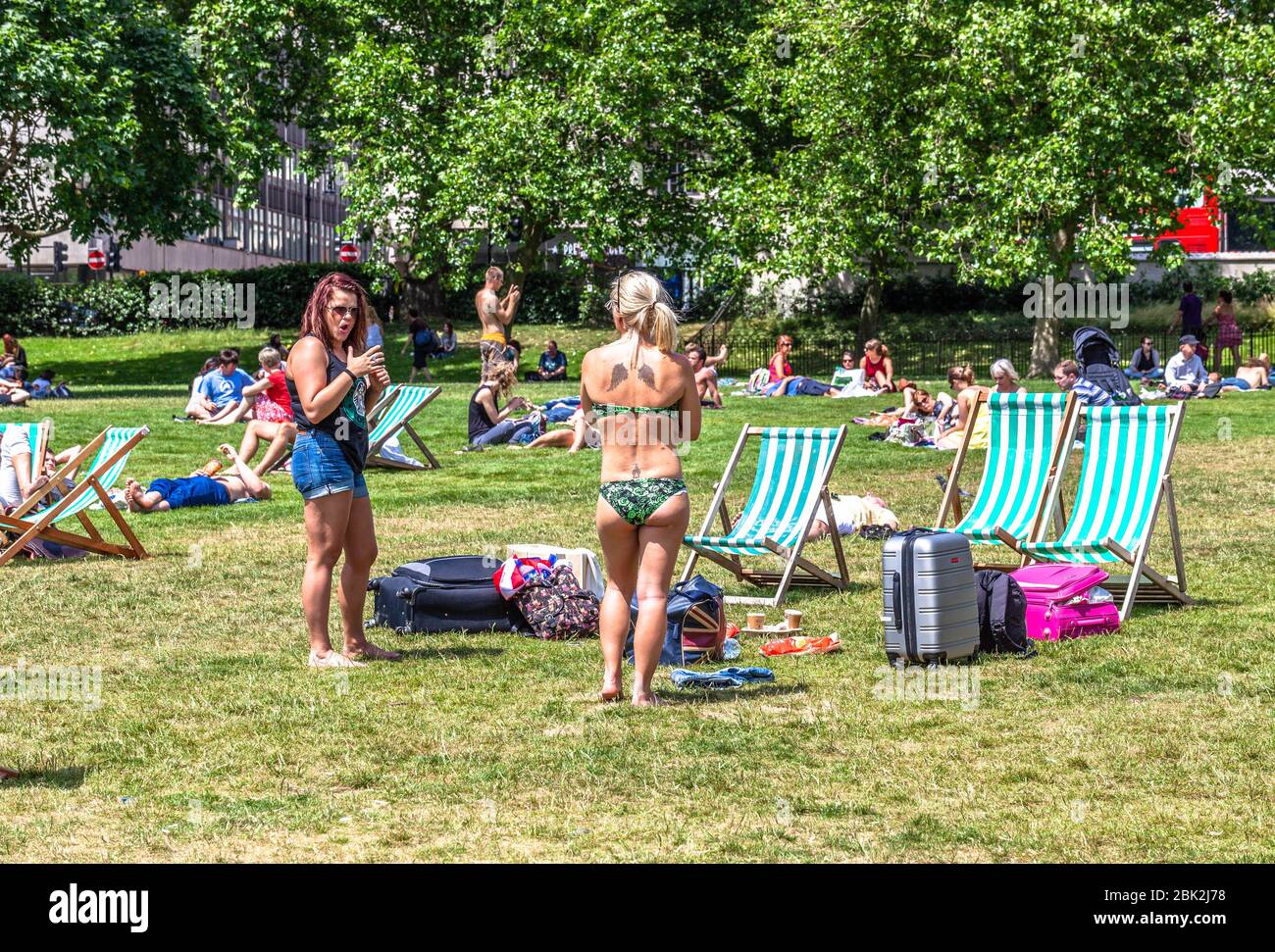 Multitude of sunbathers at Green Park, London, England, UK. Stock Photo