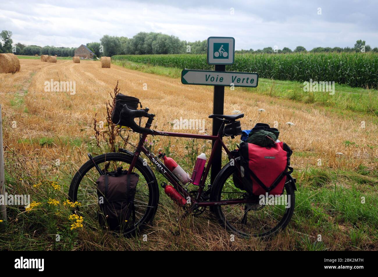 Cycle leaning against a sign for the 'Voie Verte' or 'Green Way' a network of waymarked quiet cycle routes in France Stock Photo
