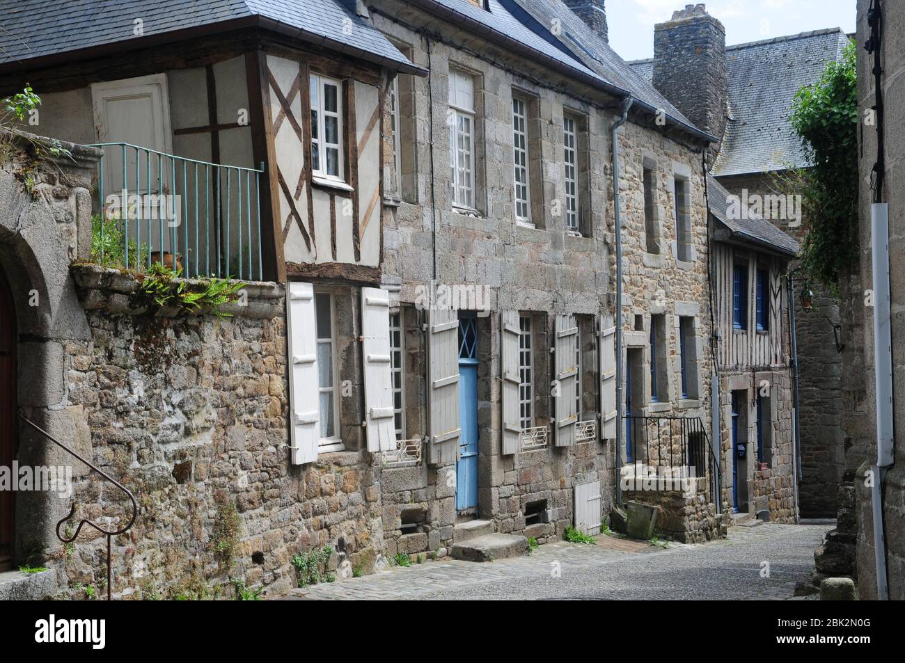 Historic timbered buildings in the historic hilltop town of Moncontour, Brittany, France - known as a walled 'Petite Cite' Stock Photo