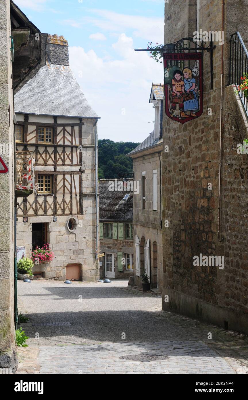 Historic timbered buildings in the historic hilltop town of Moncontour, Brittany, France - known as a walled 'Petite Cite' Stock Photo