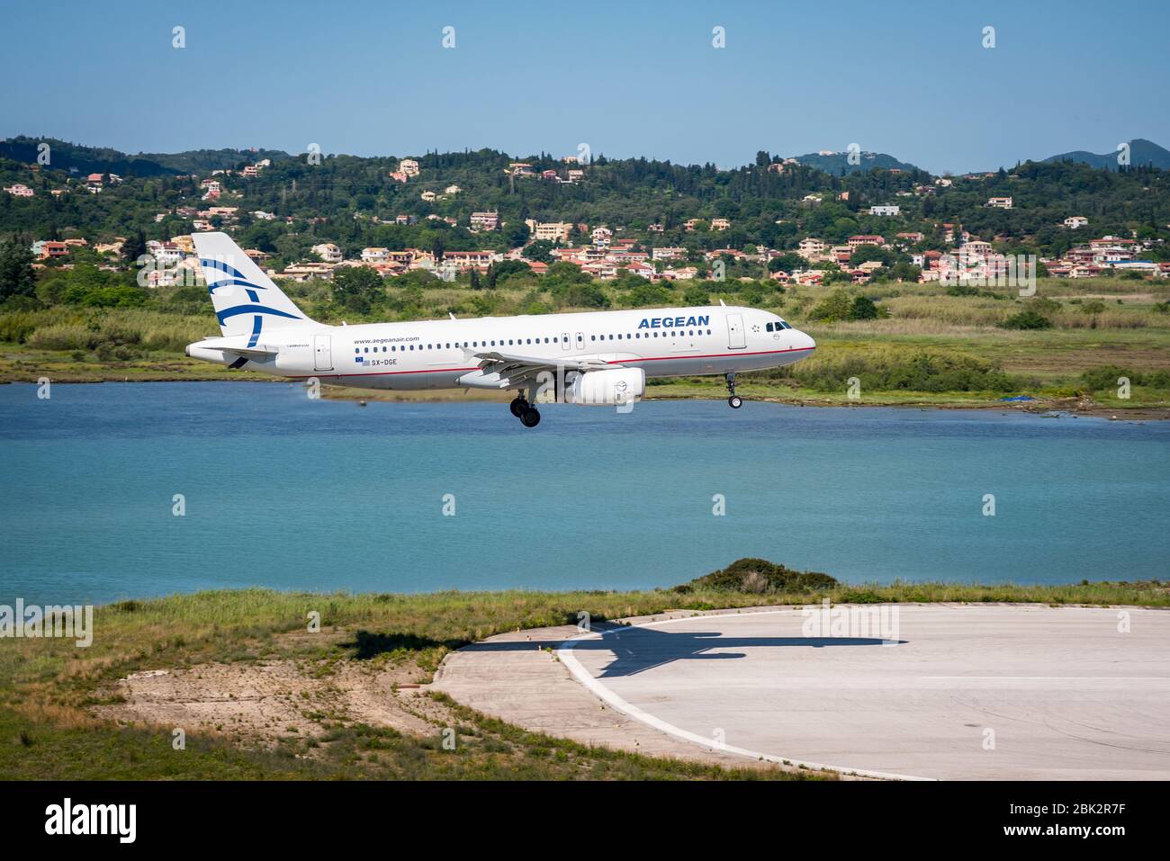 Aegean Airlines Airbus A320 aeroplane coming in to land at Corfu International Airport. Stock Photo