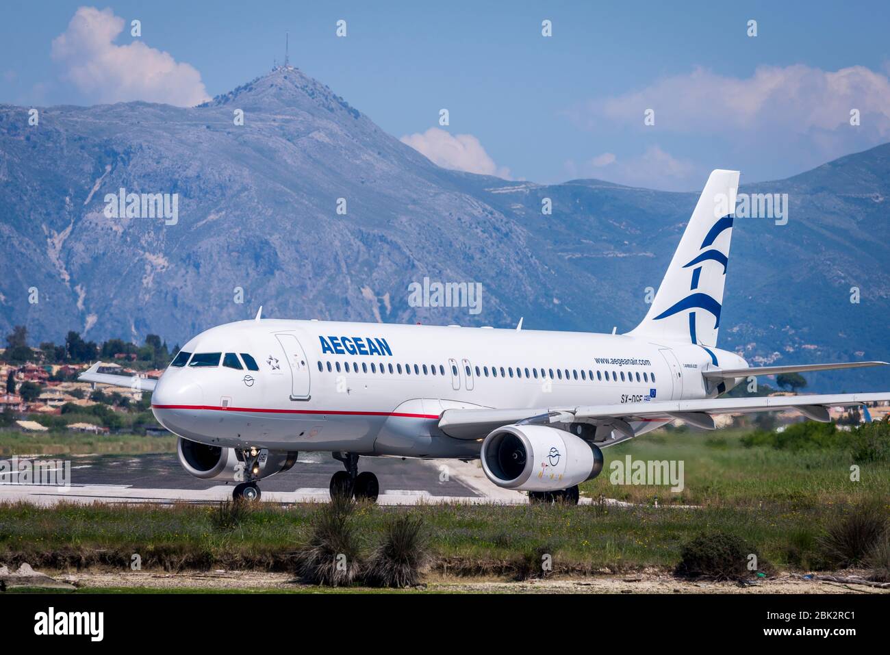 Aegean Airlines Airbus A319 aeroplane taxiing on the runway at Corfu International Airport. Stock Photo