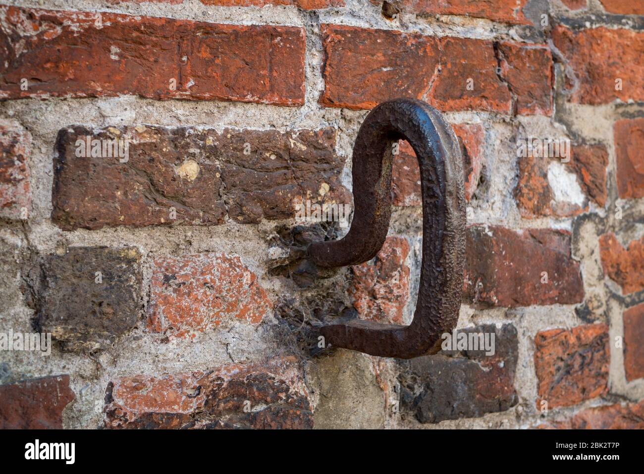 Old iron hook in a brick wall Stock Photo Alamy