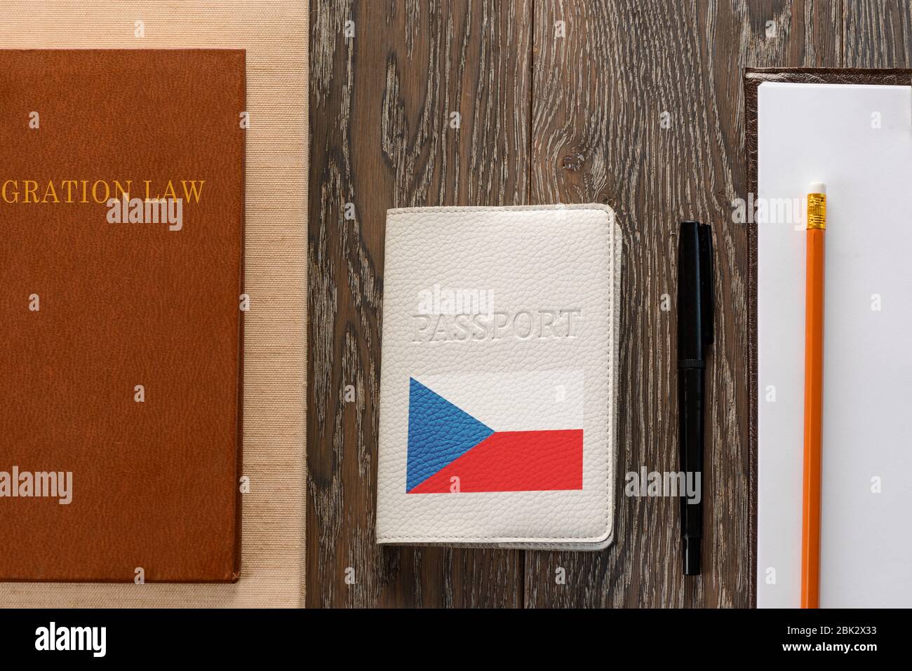 Czech passport, law book, application form and pen Stock Photo
