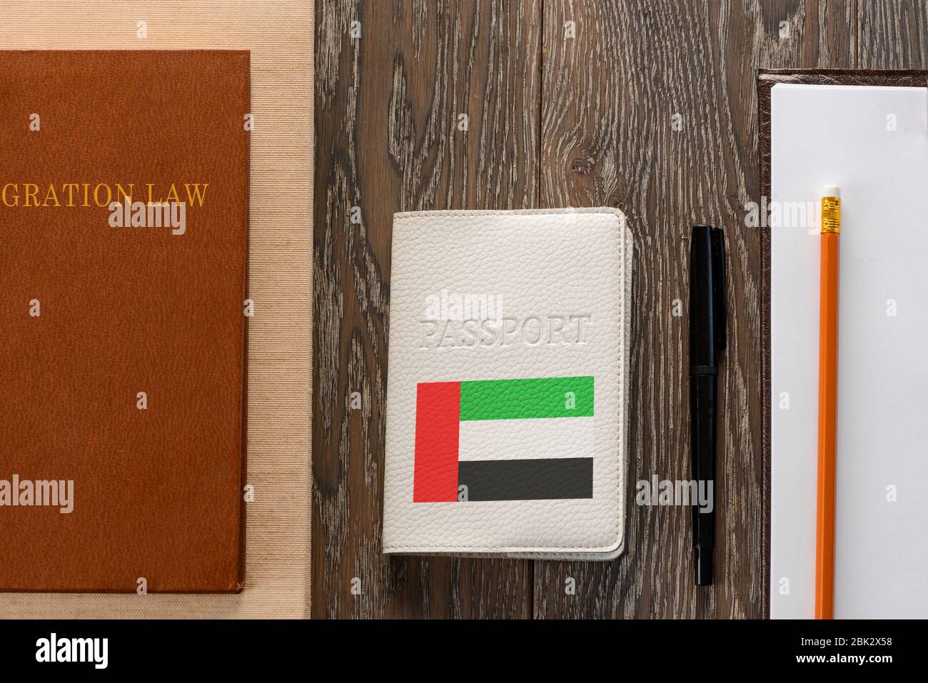 UAE passport, law book, application form and pen Stock Photo Alamy