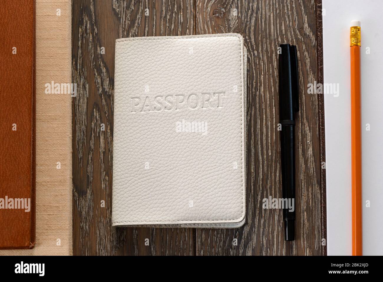 Passport, law book, application form and pen Stock Photo