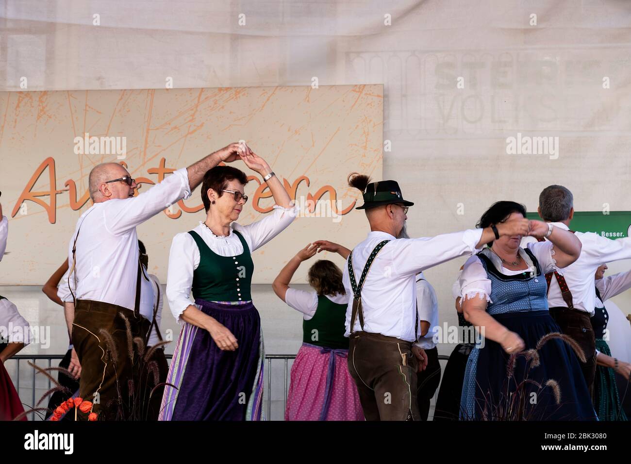 Graz/Austria - September 2019: annual autumn festival of Styrian folk culture (Aufsteirern). Folk dances of Styrian men and women in bright traditiona Stock Photo