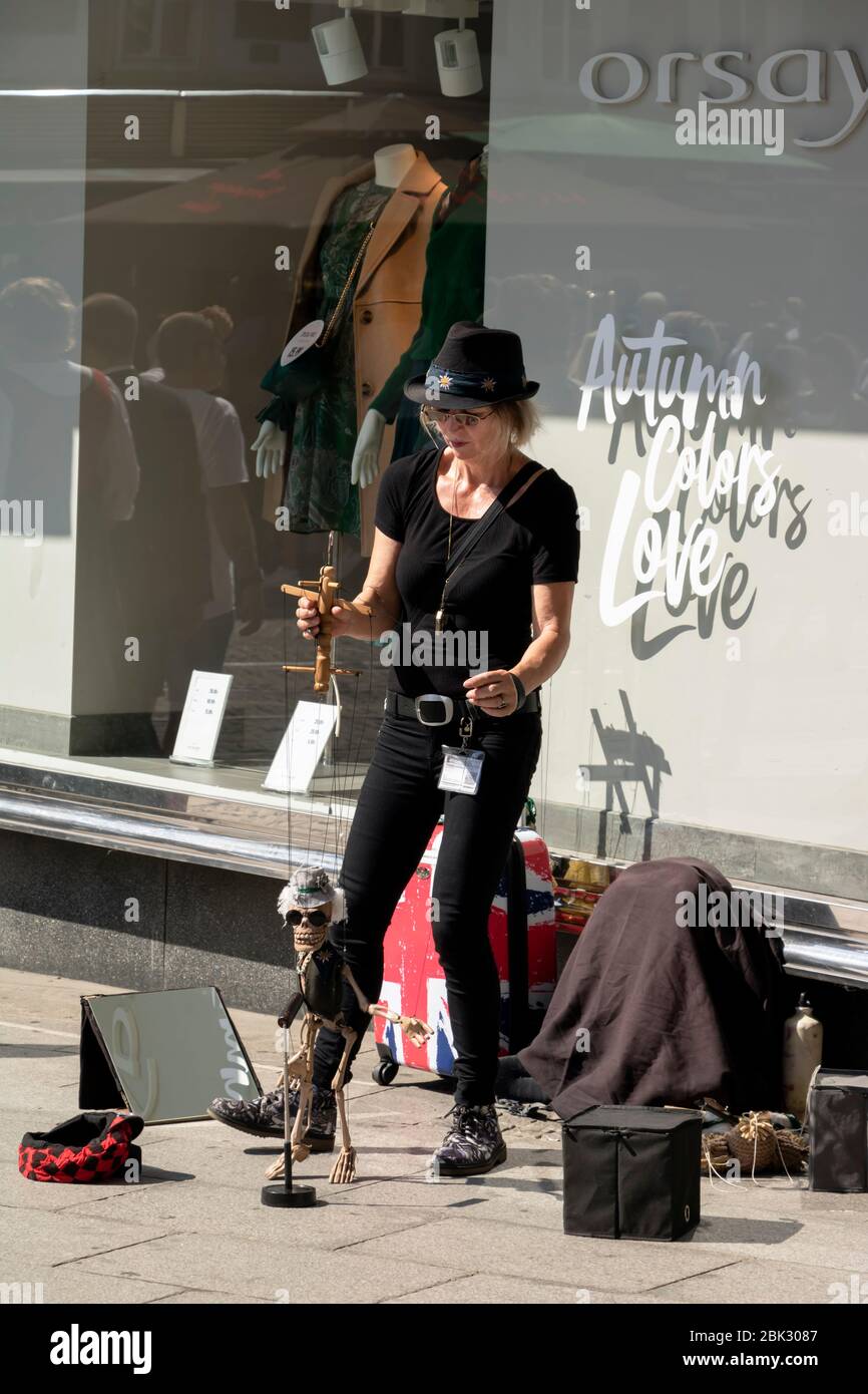 Graz/Austria - September 2019: Performance of a street Puppeteer with a funny wooden puppet in the form of a skeleton Stock Photo