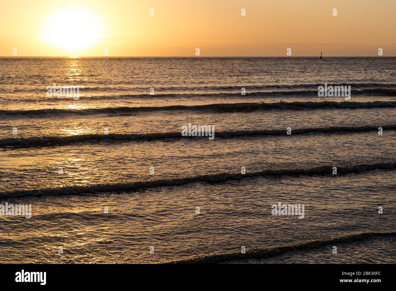 Sunset On The Beach With Brilliant Lighting Stock Photo - Alamy