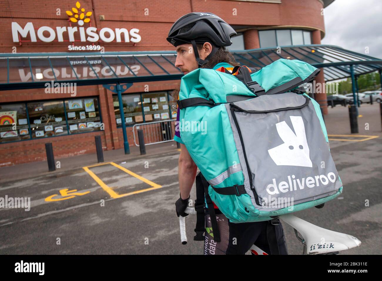 Supermarket retailer Morrisons has partnered with Deliveroo to offer beer and wine delivered direct to people's homes, Leeds. Stock Photo