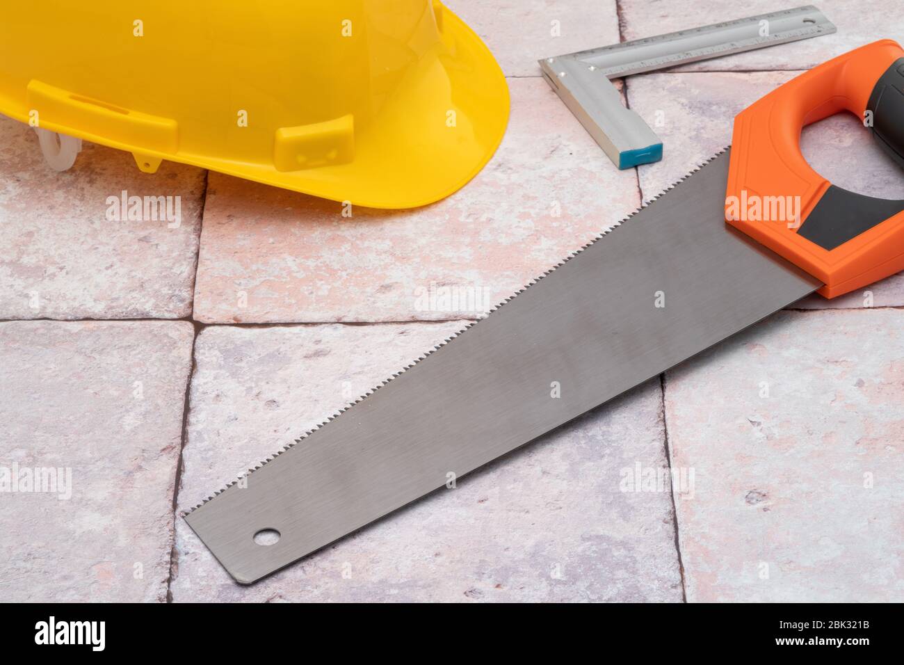 Carpenters work tools and yellow construction hat Stock Photo