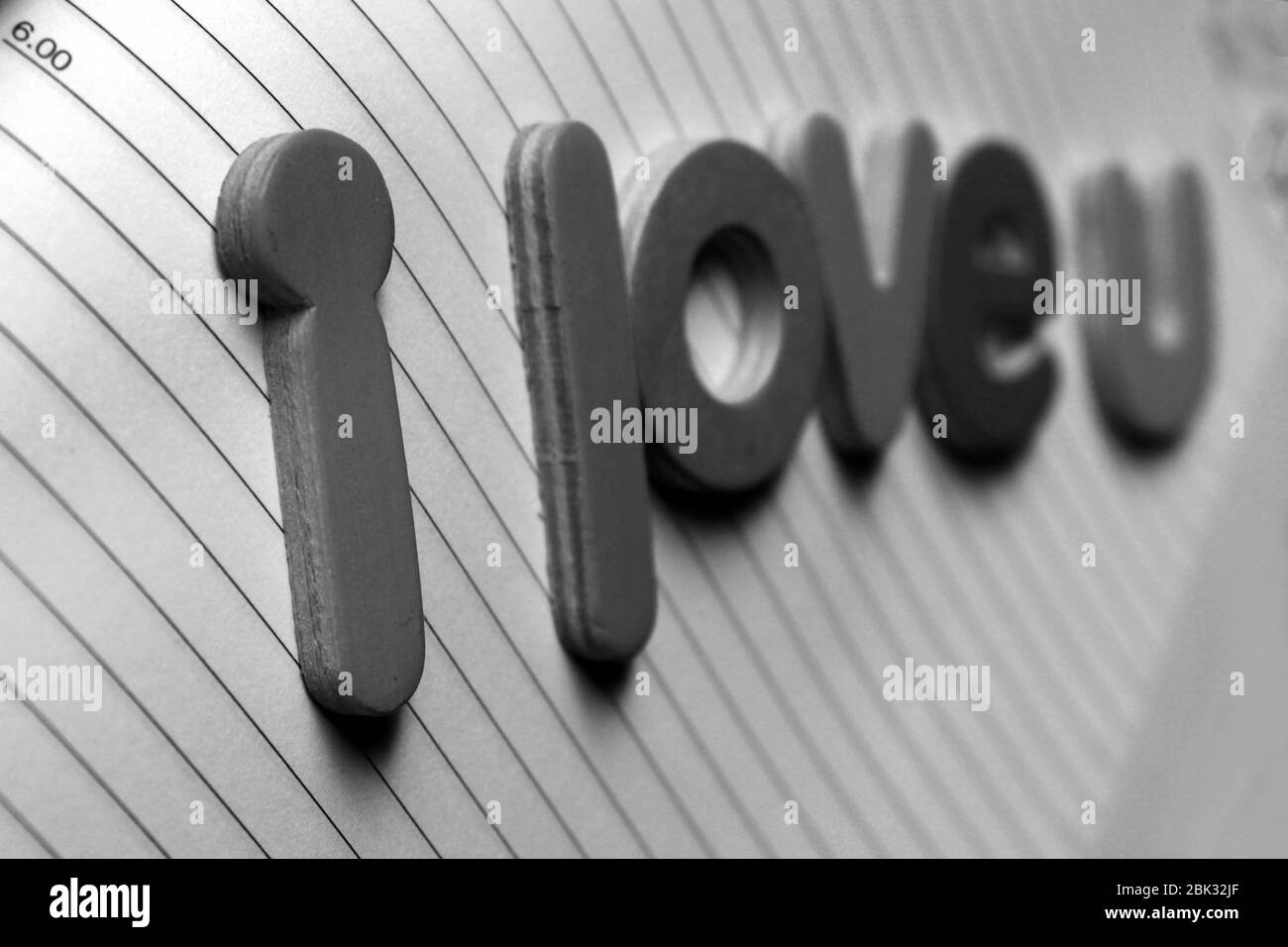 I love you card on white background. I love you concept. Colored letter spelling the words I Love You. I love you  on diary page. Stock Photo