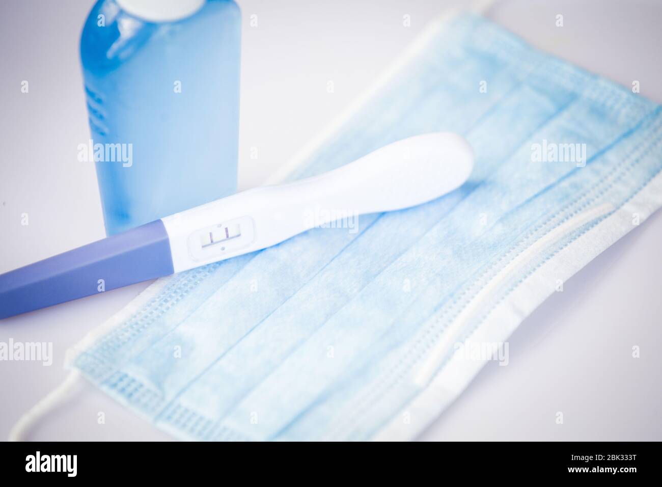 Positive pregnancy test during coronavirus pandemic Stock Photo