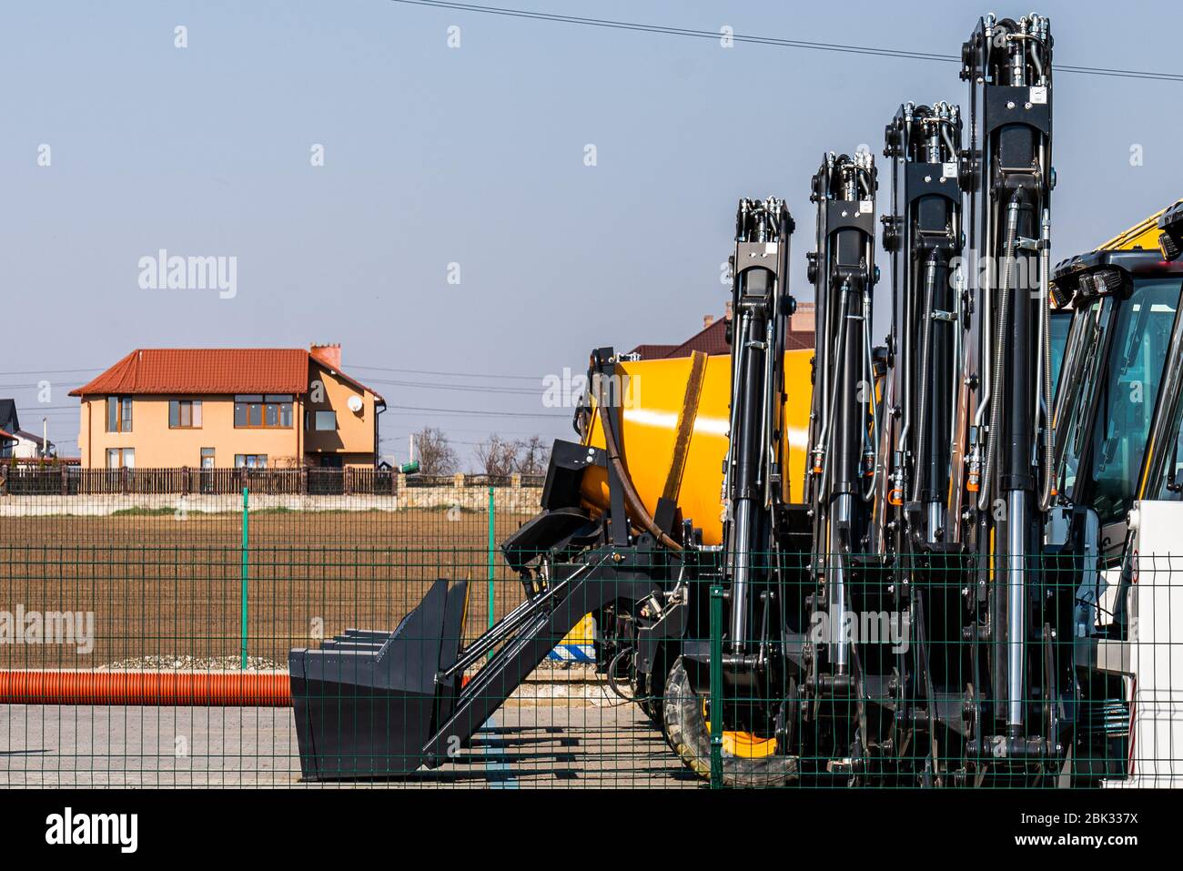 Bucket excavator loaders closeup, tractor details on a shop with