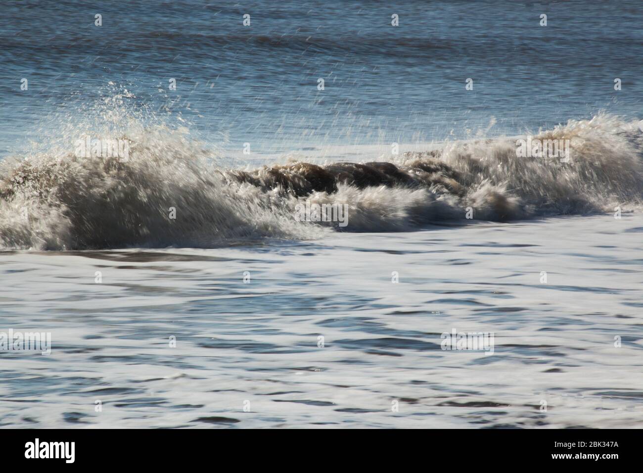 Ocean waves breaking at the beach Stock Photo - Alamy