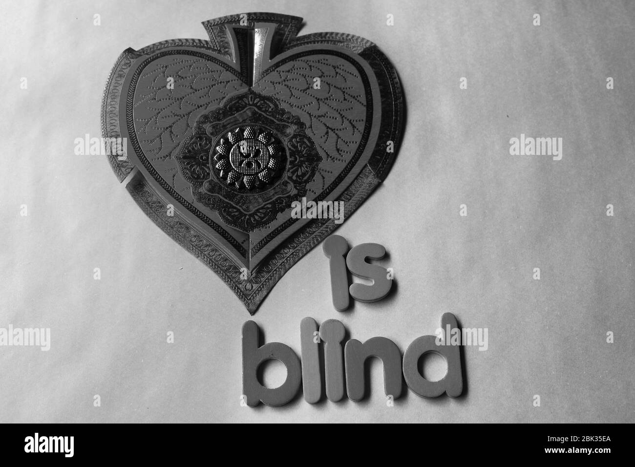 Love is blind words written on pink backgrounds. Stock Photo