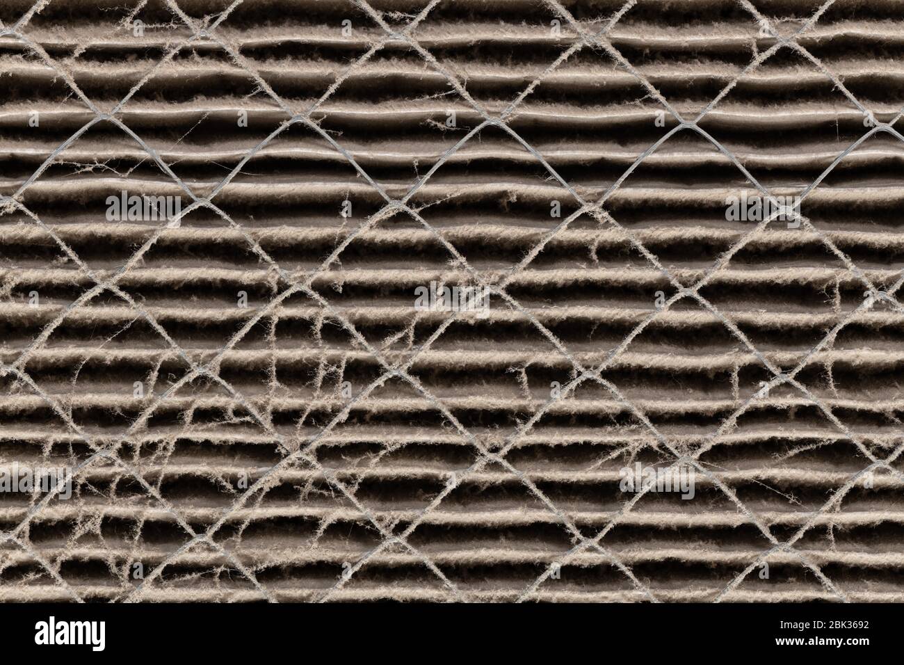 Close up of HVAC home air filter showing the dirt and particle cause