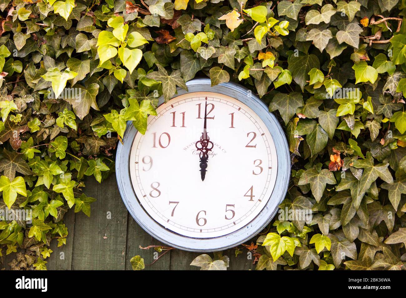 Midday, 12 o'clock, midnight, outdoor clock, time, clock, wall clock, clock outside, 12AM, 12 PM, outside, outdoors clock, outdoors, Stock Photo