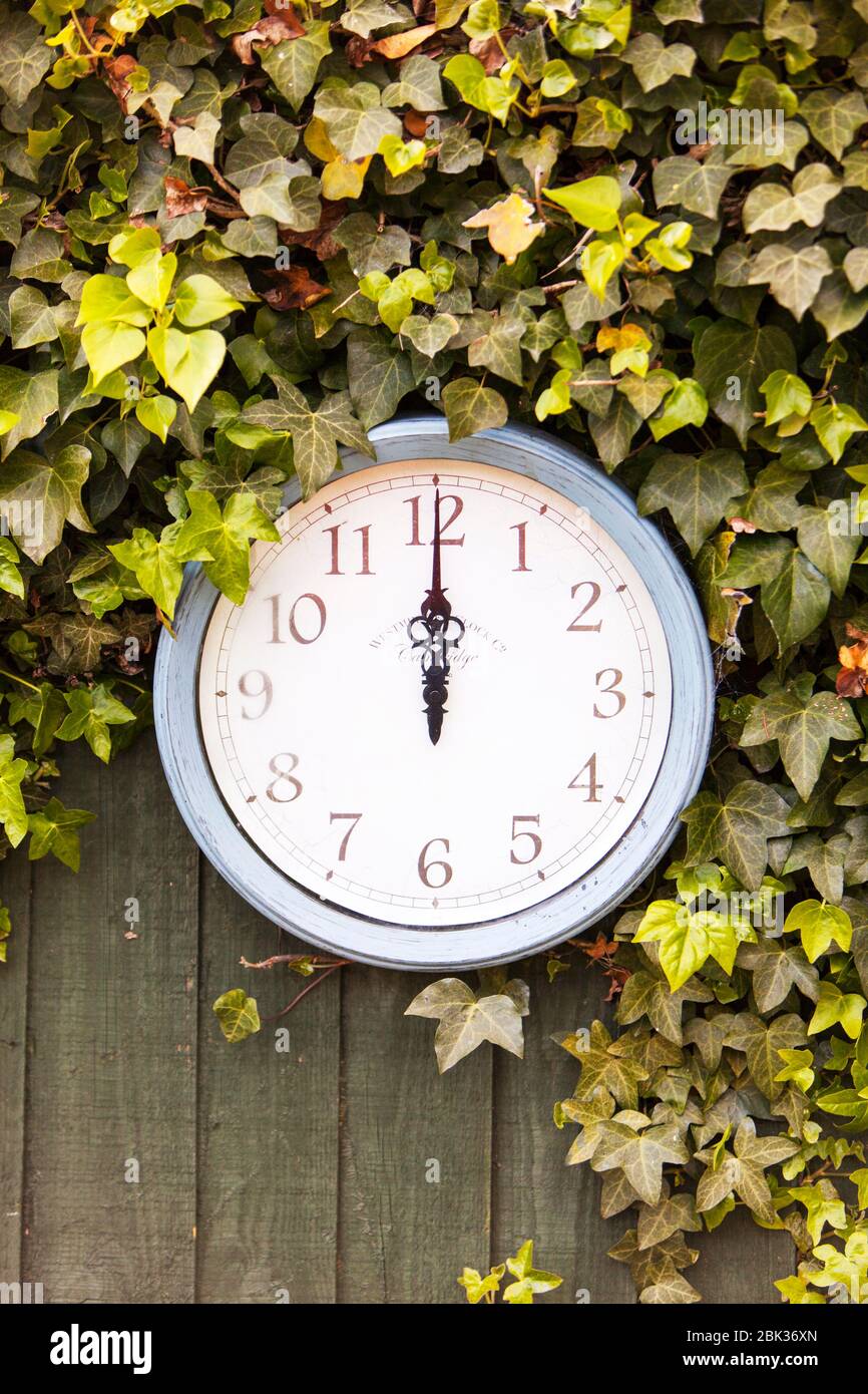 Midday, 12 o'clock, midnight, outdoor clock, time, clock, wall clock, clock outside, 12AM, 12 PM, outside, outdoors clock, outdoors, Stock Photo