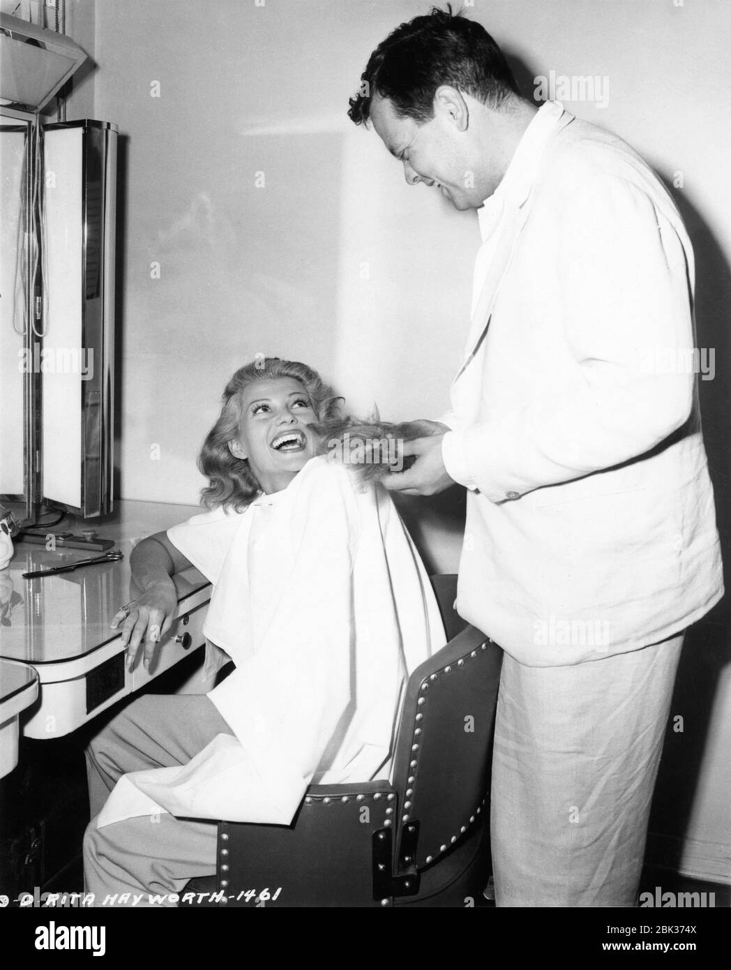 RITA HAYWORTH getting hair cut and dyed blonde candid with ORSON WELLES  during production of THE LADY FROM SHANGHAI 1947 director / screenplay  ORSON WELLES based on novel by Sherwood King gowns